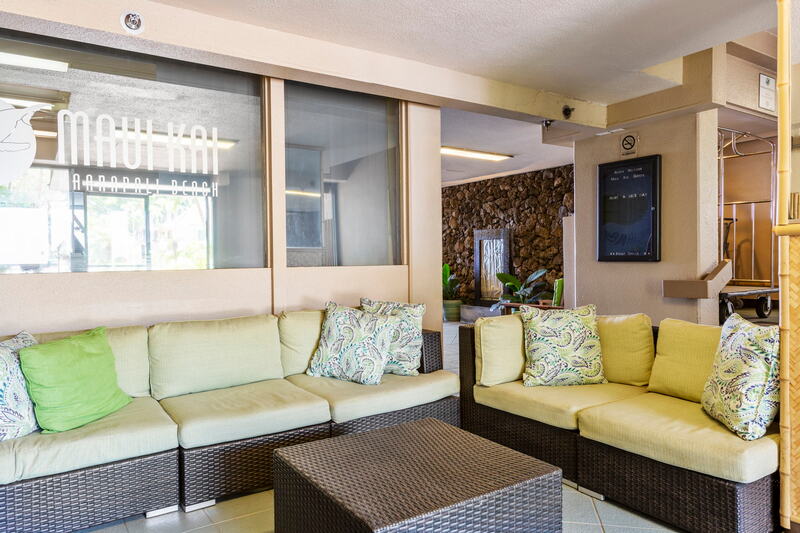 Maui Kai 806 living area with Tommy Bahama style and ocean views, perfect Maui getaway