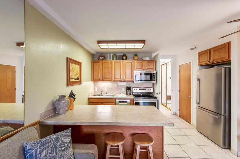 Maui Kai 806 kitchen with ocean views and all cooking essentials, perfect for vacation cooking