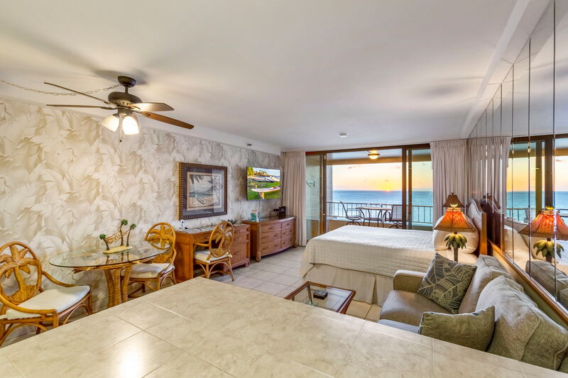 Maui Kai 806 living area with entertainment center and ocean views, Maui vacation rental