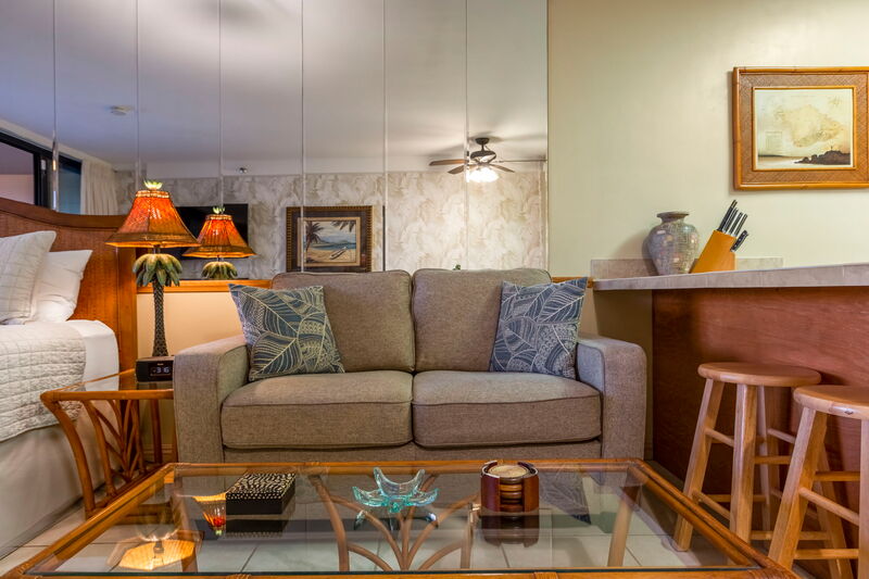 Maui Kai 806 living room with ocean backdrop and Tommy Bahama furniture, Maui vacation rental